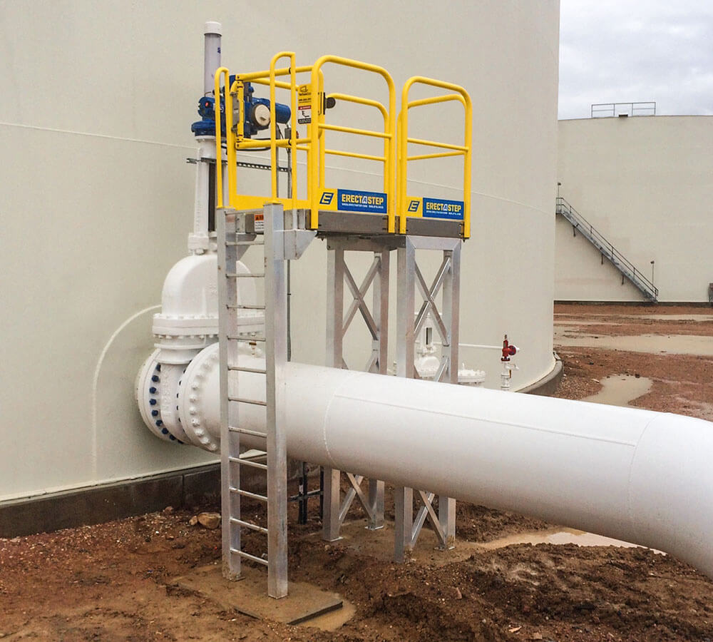 Erectastep crossover industrial stairs next to tanks at Petrochem Colorado