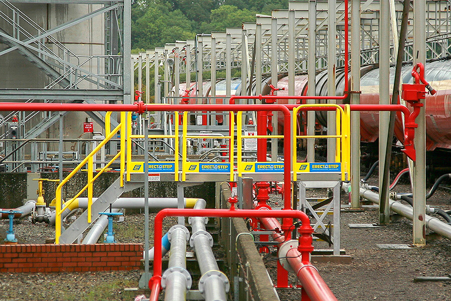 Erectastep pipe crossover stairs in outdoor industrial facility