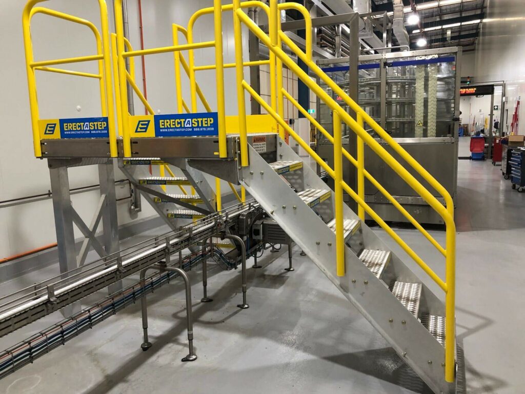 Crossover platform in a conveyor belt system by a food manufacturer in Australia