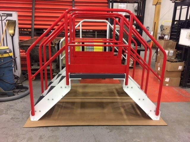 Side View of Red Conveyor Crossover Stairs