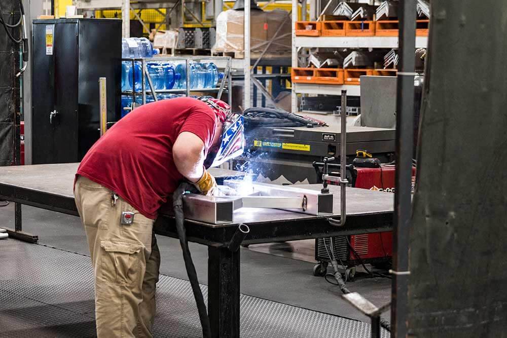 Image of experienced metal worker building Metal Stairs