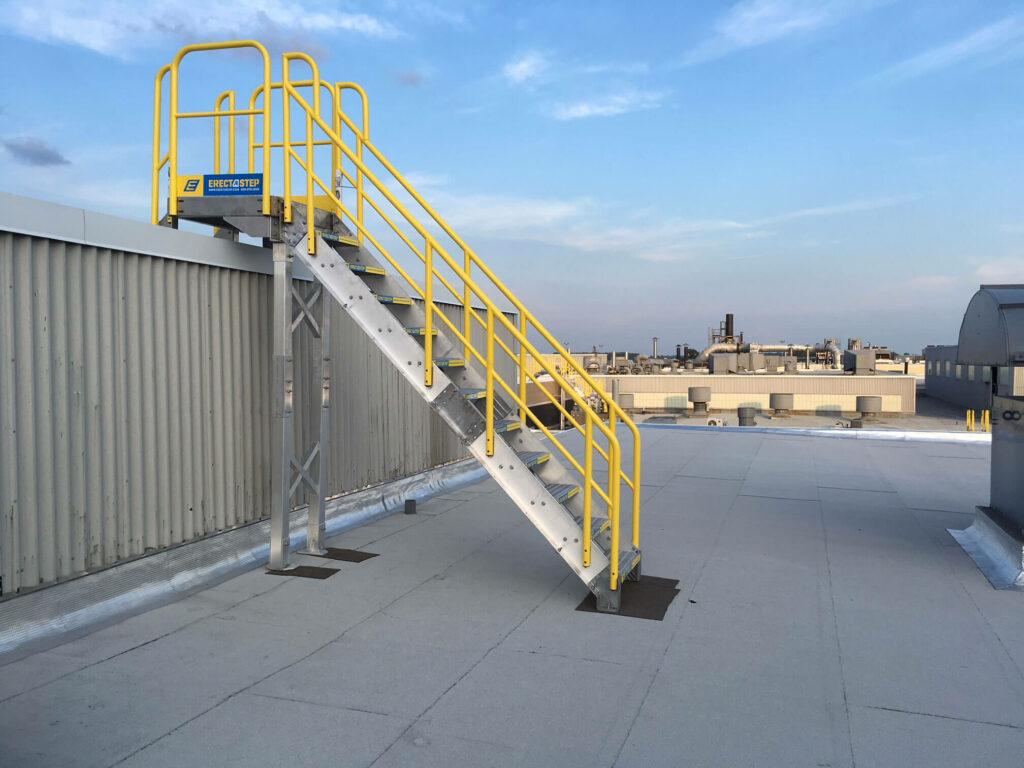 Side View of Roof Access Metal Stairs With Aluminum Handrails on Rooftop